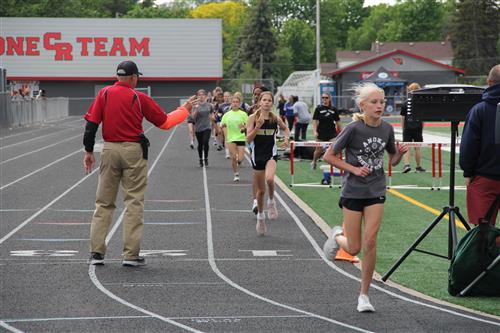 Girls running track event