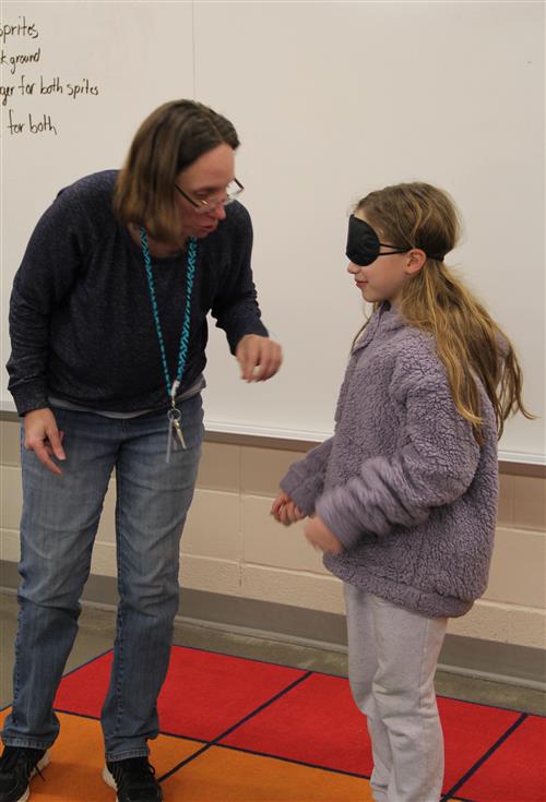 Teacher helping child