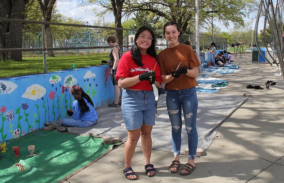 Claire Temtreull and Nichole Jacquez lead youth service mural at Anoka Aquatic Center