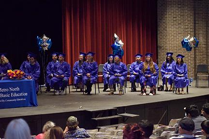 graduates sitting in chairs