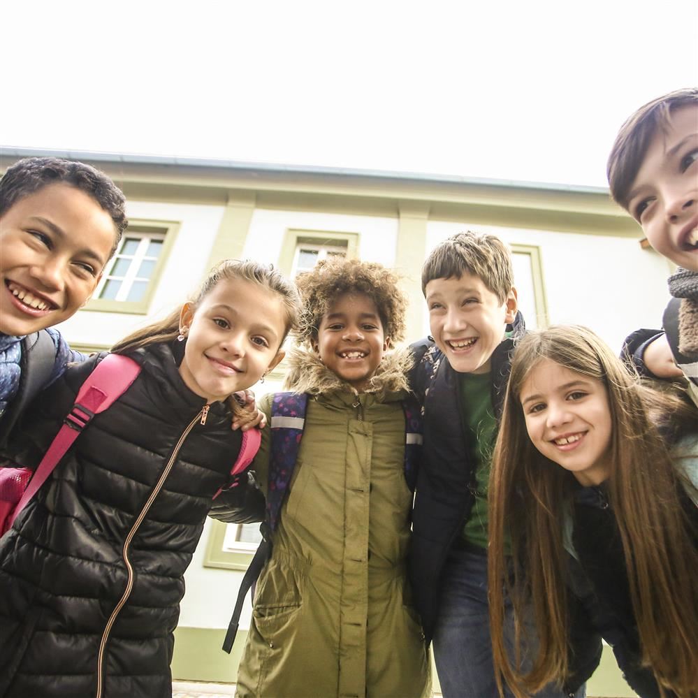Children standing in front of school